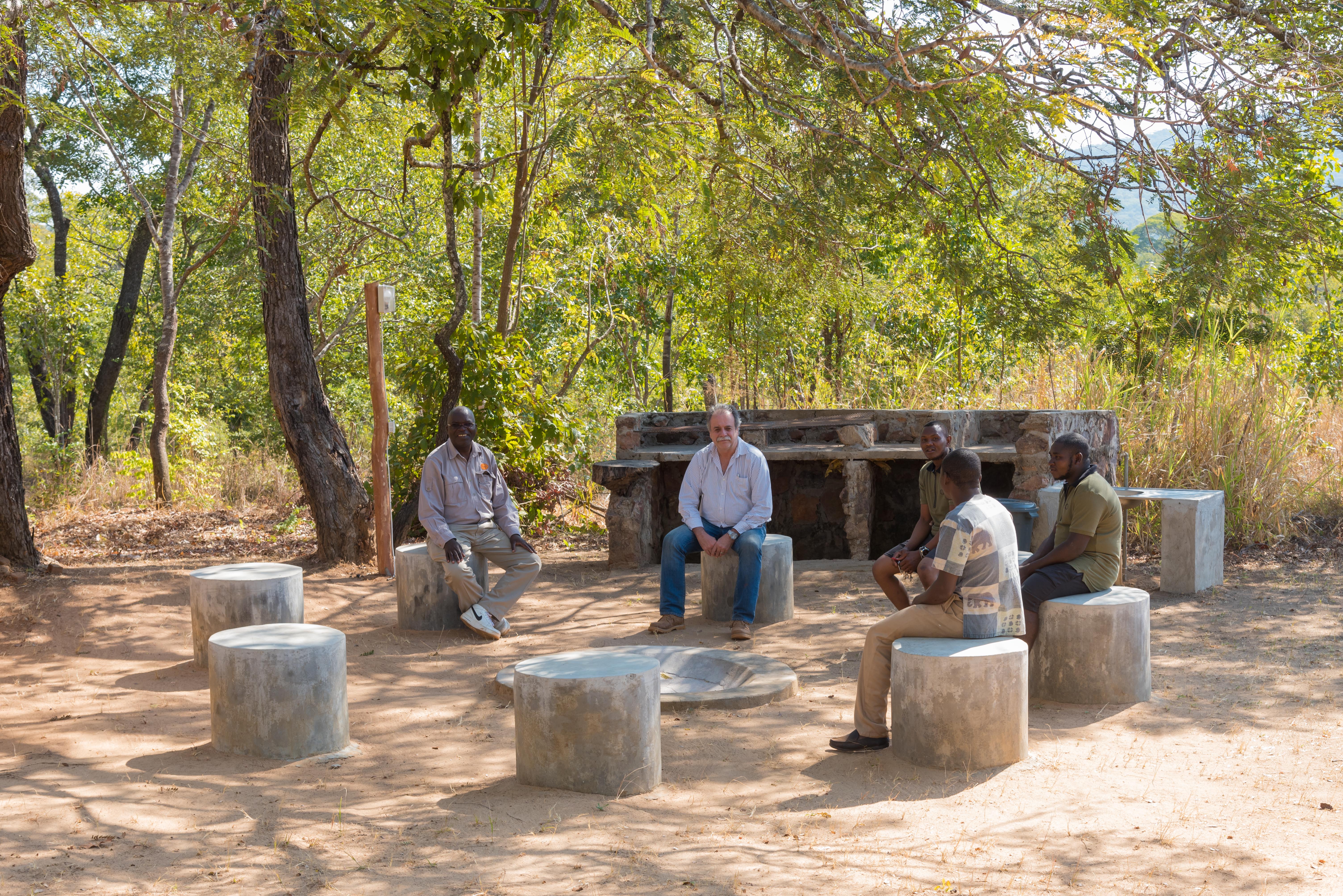 Guests around a bonfire at night